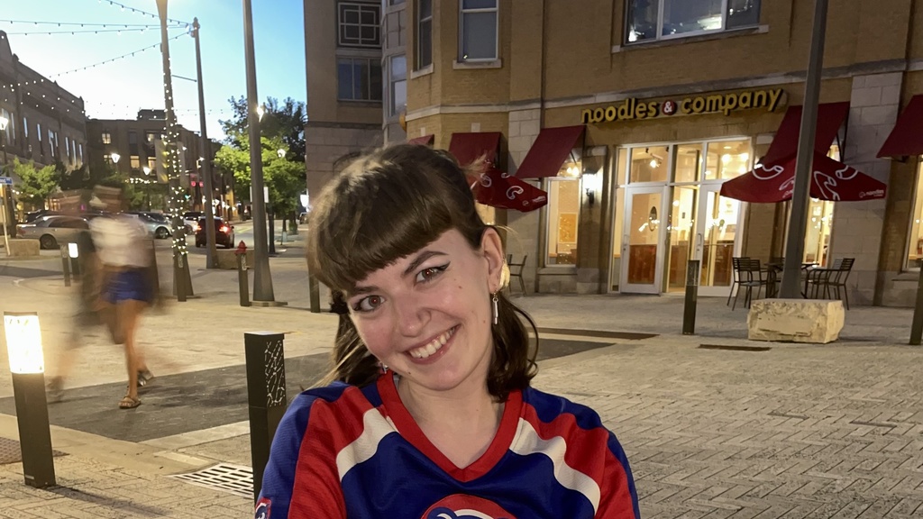Photo of Hope, current Public Relations chair. She is in a Cubs jersey.